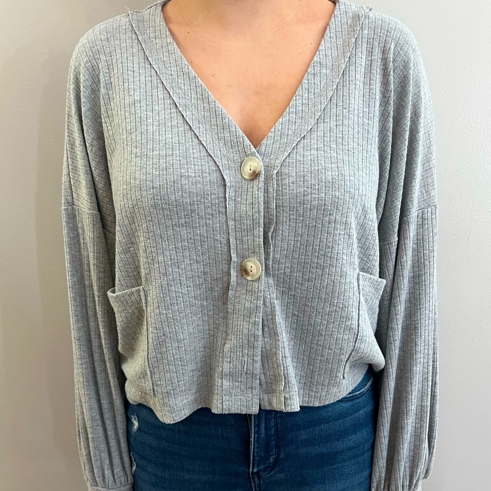 Size small, grey, long sleeve button down shirt.